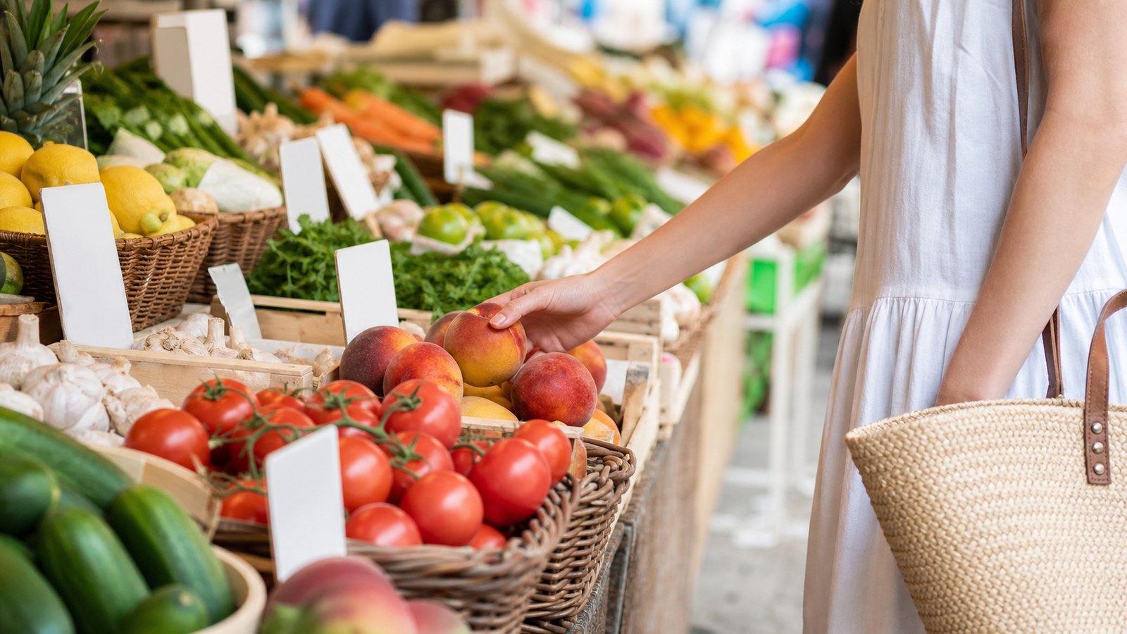 Person choosing among market goods symbolizing individual choice in free markets